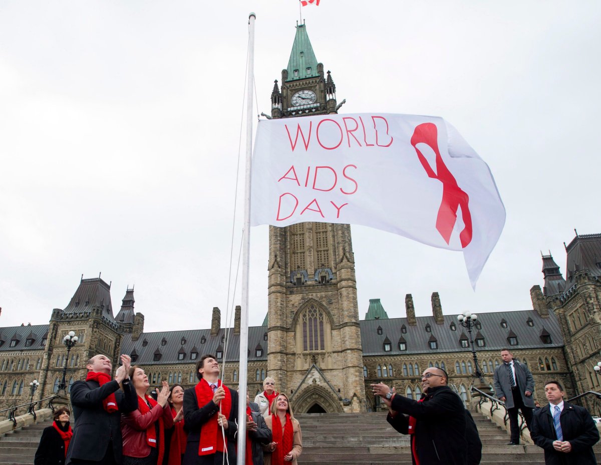File photo - Prime Minister Justin Trudeau raises the World AIDS Day flag in Ottawa Thursday, Dec. 1, 2016. 