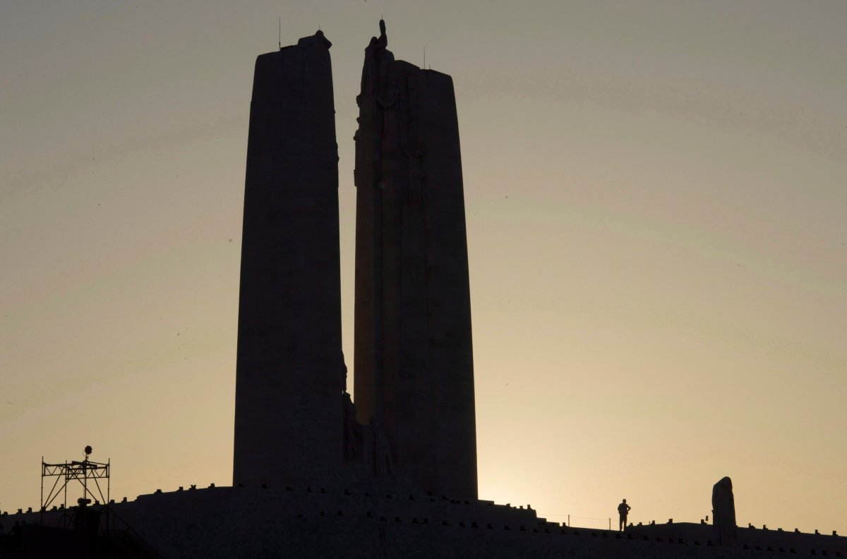 A person is silhouetted as they stand on the Vimy Ridge monument following a ceremony to mark the 100th anniversary of the battle, Sunday, April 9, 2017 near Arras, France. 