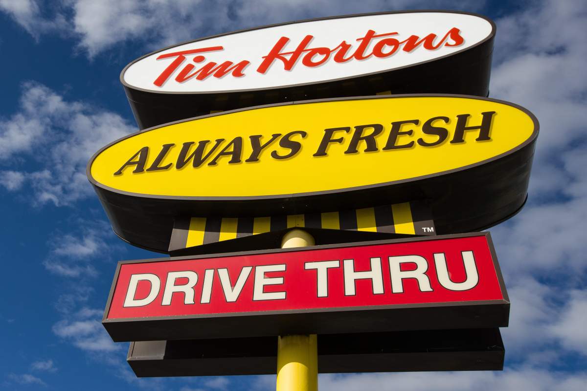 A woman was arrested outside a Tim Hortons in Port Hope after she allegedly spat in the face of another person.