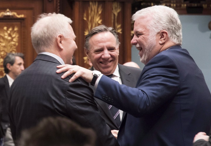 In this file photo, Quebec Premier Philippe Couillard, right, Parti Québécois Leader Jean-François Lisée, left, and Coalition Avenir Quebec Leader François Legault, centre, exchange greetings.