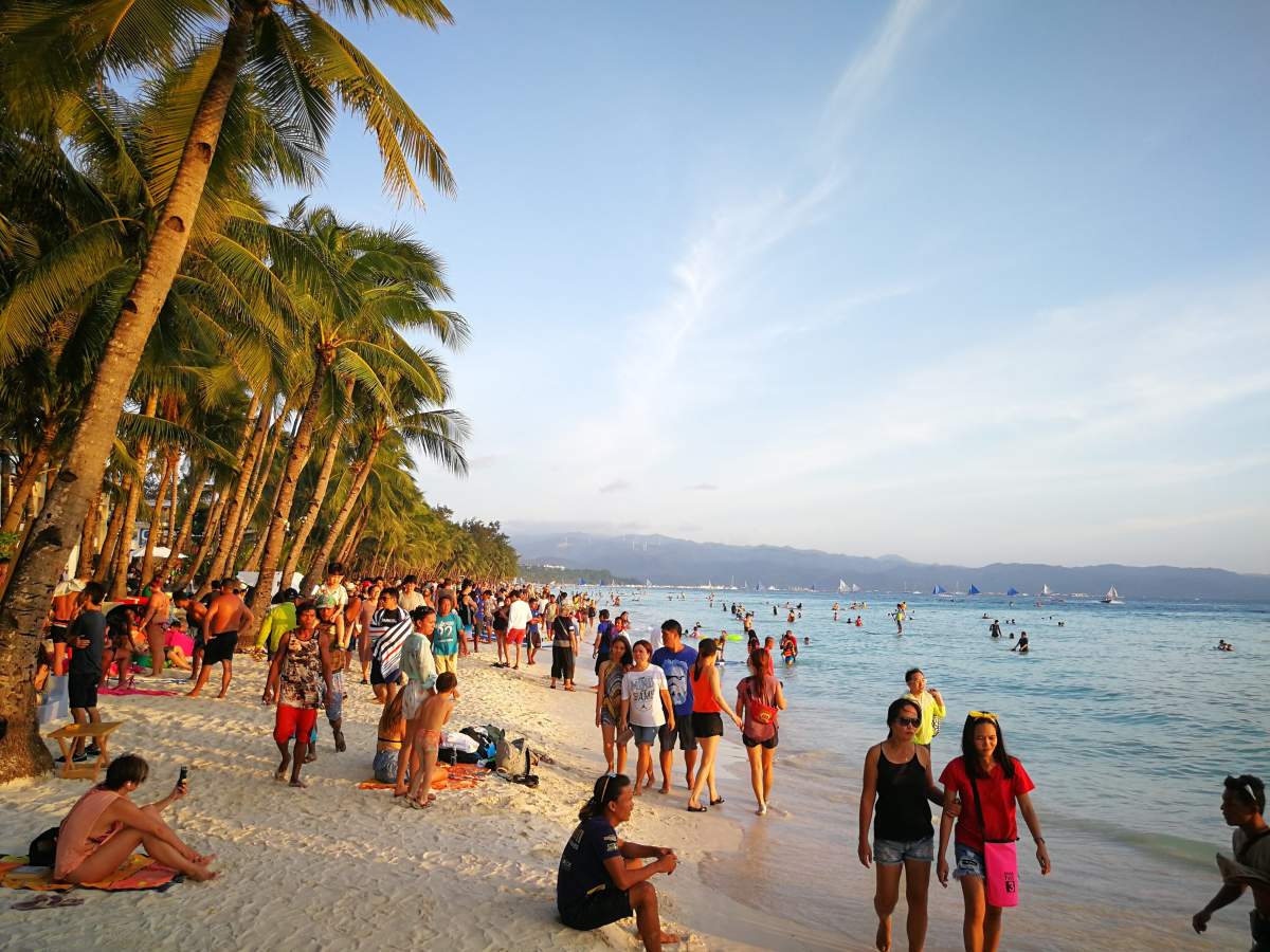 Tourists enjoy at a beach on Boracay Island on March 26, 2018, ahead of the closure of the beach. President Duterte’s revealed plans to shut down Boracay Island to rehabilitate the region, despite critics opposing the closure as it may affect tourism in the region.