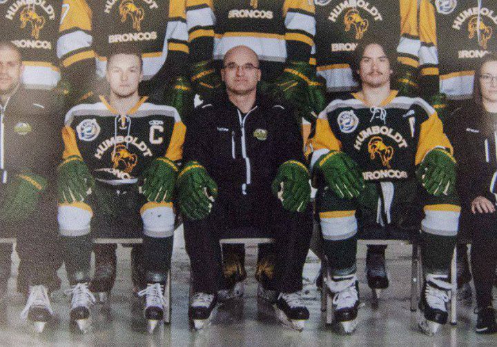 Head coach and general manager Darcy Haugan, centre, is shown in team photo of the 2016/2017 Humboldt Broncos hockey team as it hangs in Elgar Petersen Arena in Humboldt, Sask., on Saturday, April 7, 2018. The head coach of the Humboldt Broncos hockey team is among 14 dead following a horrific bus crash in Saskatchewan. Darcy Haugan was on the junior hockey team’s bus Friday on the way to a playoff game in northeastern Saskatchewan when it collided with a truck. THE CANADIAN PRESS/Liam Richards
