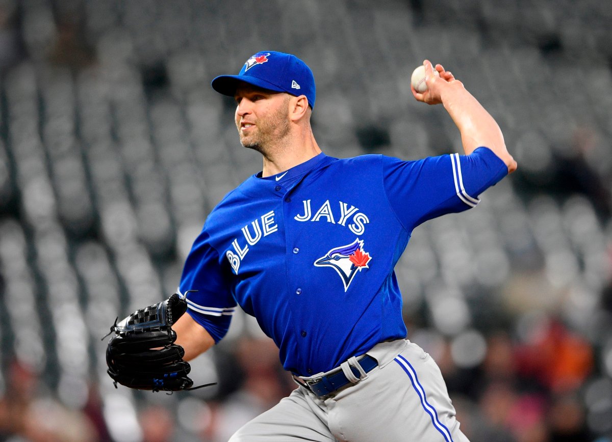 Toronto Blue Jays starting pitcher J.A. Happ delivers during the first inning of a baseball game against the Baltimore Orioles, Monday, April 9, 2018, in Baltimore. 