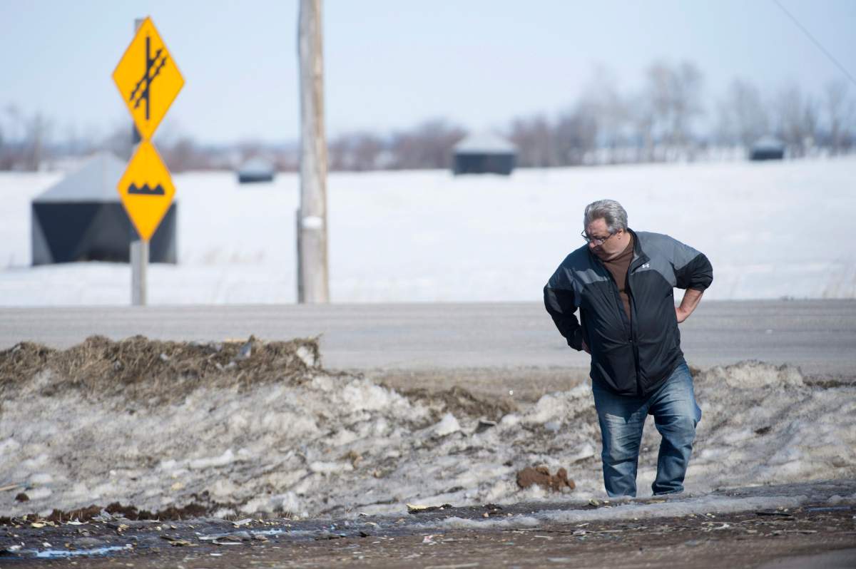 Myles Shumlanski looks around the intersection of a fatal bus crash near Tisdale, Sask., Tuesday, April, 10, 2018.