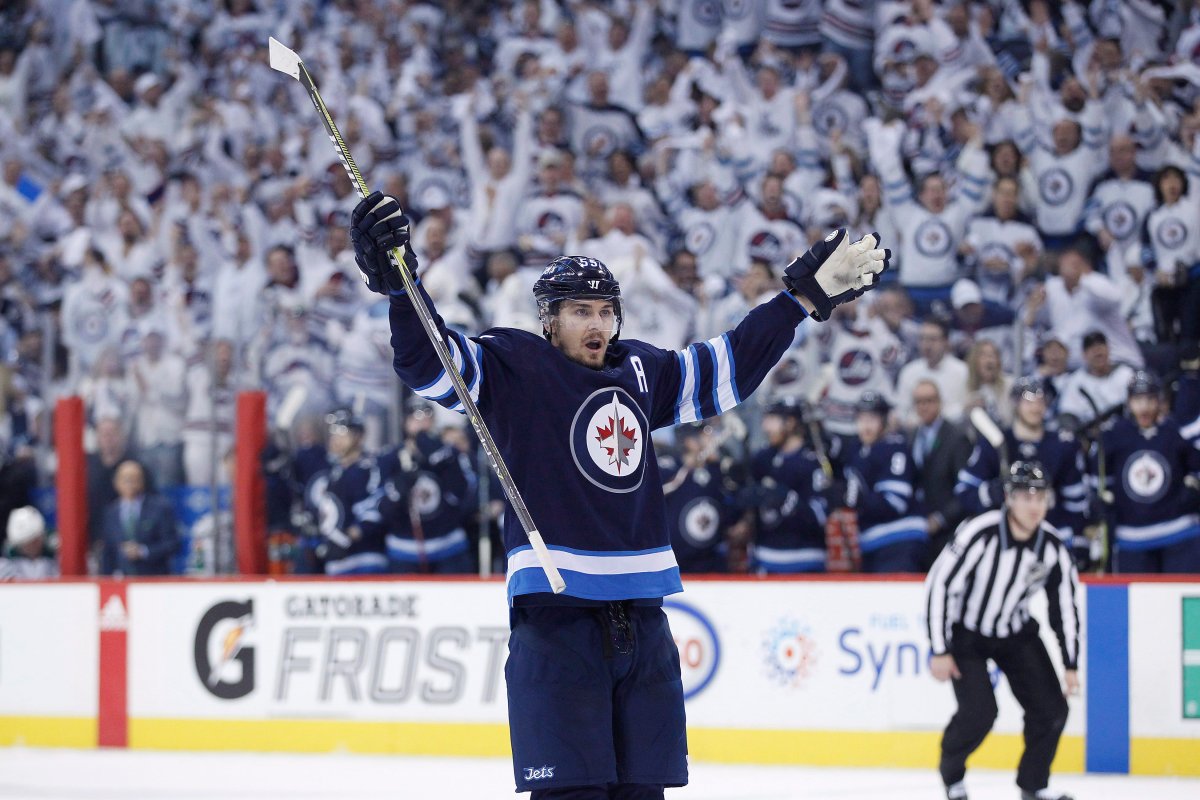 Winnipeg Jets' Mark Scheifele (55) celebrates his goal against the Minnesota Wild during second period NHL game one playoff action in Winnipeg on Wednesday, April 11, 2018. THE CANADIAN PRESS/John Woods.