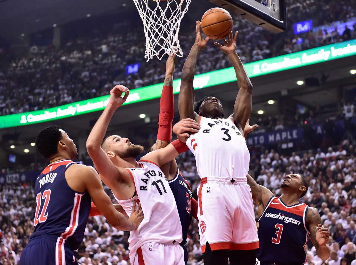 Toronto Raptors forward OG Anunoby (3) shoots as Washington Wizards forward Otto Porter Jr. (22), Raptors centre Jonas Valanciunas (17) and Wizards guard Bradley Beal (3) look on during first half round one NBA playoff basketball action in Toronto on Saturday, April 14, 2018. 