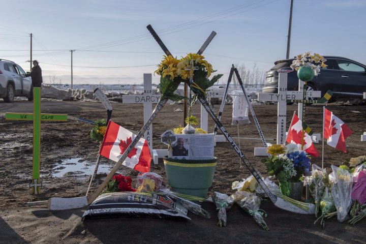 Hockey sticks, messages and other items continue to be added to a memorial at the intersection of a fatal bus crash that killed 16 members of the Humboldt Broncos hockey team.