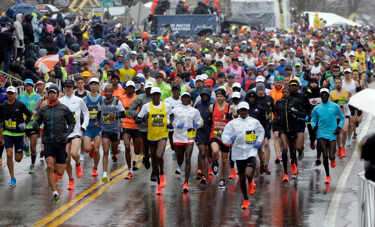 The field of men's elite runners leave the starting line in the 122nd Boston Marathon on Monday, April 16, 2018, in Hopkinton, Mass. 