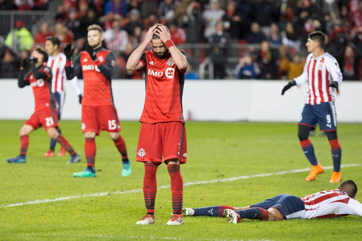 Toronto FC's Drew Moor reacts after missing a goal scoring chance during second half CONCACAF Champions League final first leg action against Chivas de Guadalajara, in Toronto on Tuesday, April 17, 2018. 