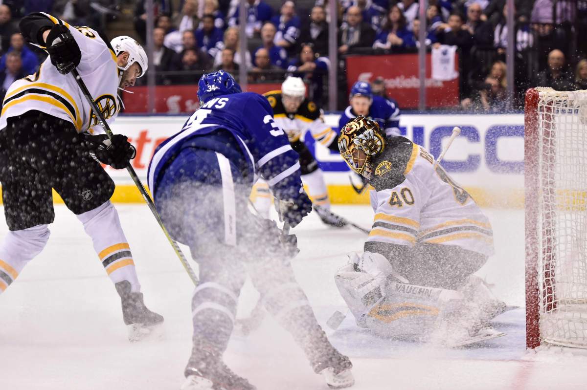 Toronto Maple Leafs center Auston Matthews (34) battles Boston Bruins defenceman Zdeno Chara (33) in front of goaltender Tuukka Rask (40) during NHL round one playoff hockey action in Toronto on Monday, April 23, 2018. 