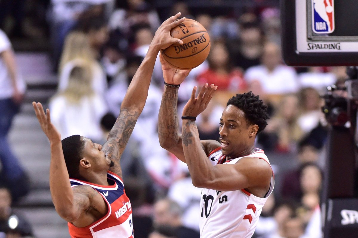 Washington Wizards' Bradley Beal takes the ball from Toronto Raptors' DeMar DeRozan during second half game five of round one NBA playoff basketball action in Toronto on Wednesday, April 25, 2018. 