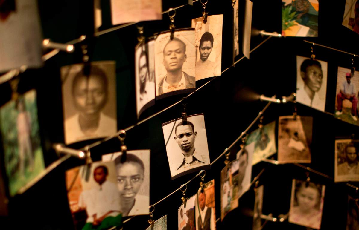 In this Saturday, April 5, 2014 file photo, family photographs of some of those who died hang in a display in the Kigali Genocide Memorial Centre in Kigali, Rwanda.