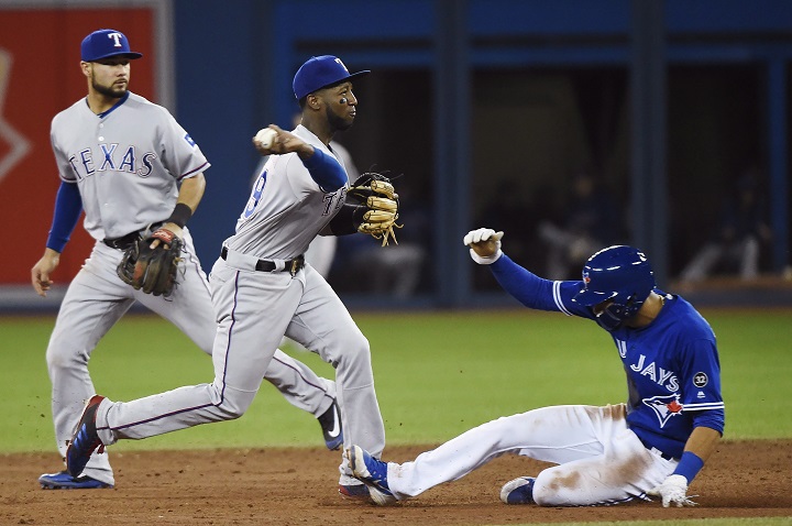 Texas Rangers shortstop Jurickson Profar (19) forces out Toronto Blue Jays second baseman Lourdes Gurriel (13) at second base during sixth inning AL baseball action in Toronto on Sunday, April 29, 2018. 