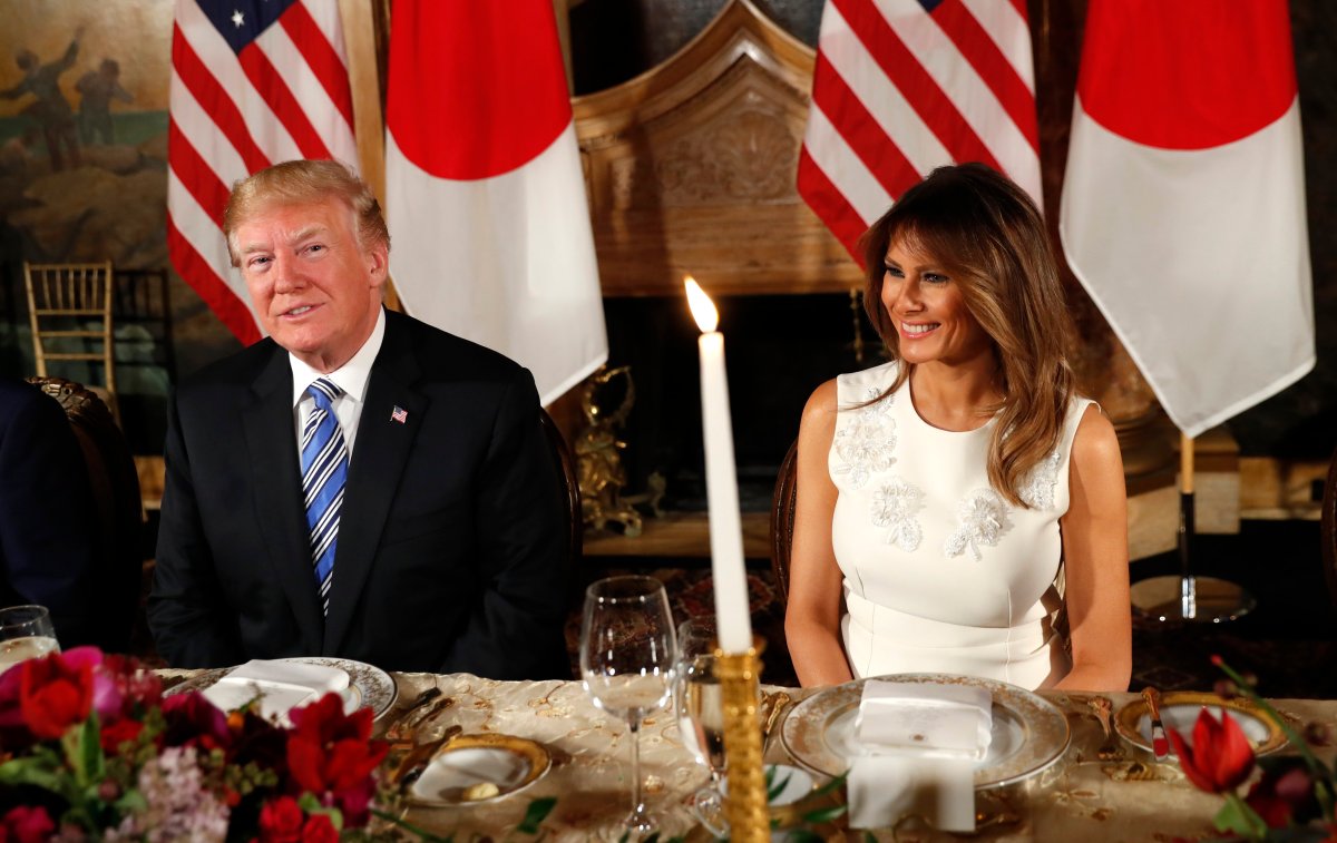 U.S. President Donald Trump and first lady Melania Trump smile while dining with Japan's Prime Minister Shinzo Abe and his wife Akie (not pictured) at Trump's Mar-a-Lago estate in Palm Beach, Florida, U.S., April 18, 2018. REUTERS/Kevin Lamarque.