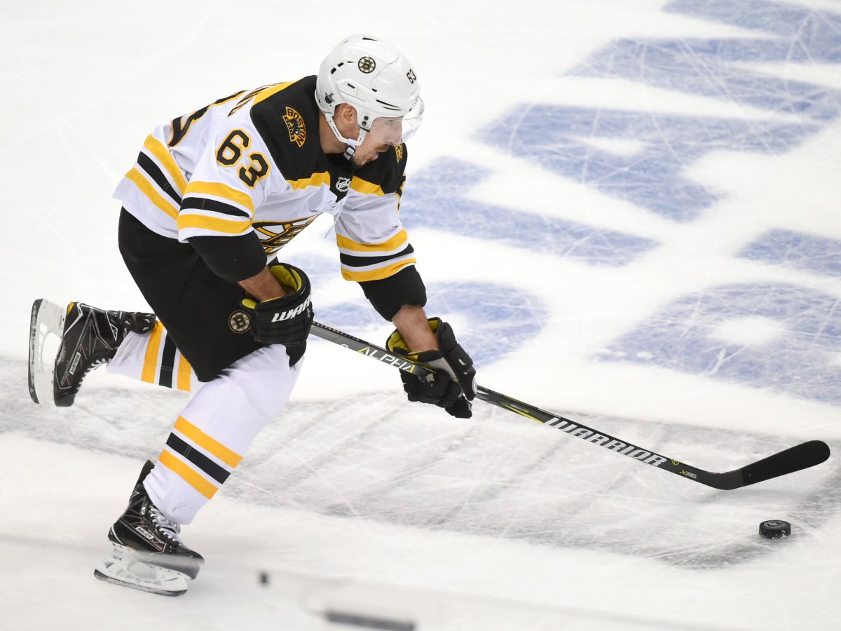 Apr 19, 2018; Toronto, Ontario, CAN;  Boston Bruins forward Brad Marchand (63) skates the puck up ice against Toronto Maple Leafs in game four of the first round of the 2018 Stanley Cup Playoffs at Air Canada Centre. 