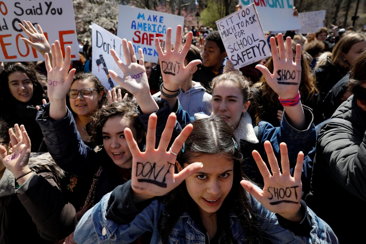 Students gather for a rally in Washington Square Park, as part of a nationwide walk-out of classes to mark the 19th anniversary of the Columbine High School mass shooting, in New York City, U.S., April 20, 2018. 