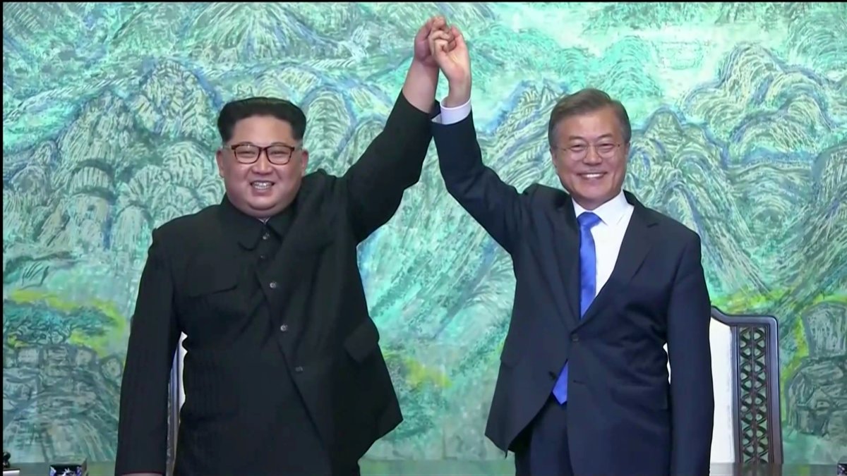 South Korean President Moon Jae-in and North Korean leader Kim Jong Un gesture after signing agreements during the inter-Korean summit at the truce village of Panmunjom, in this still frame taken from video, South Korea April 27, 2018. 