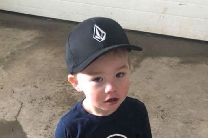Community members have identified the boy who died after falling into a septic tank in Priddis, Alta. as two-year-old Aaden Blackburn.