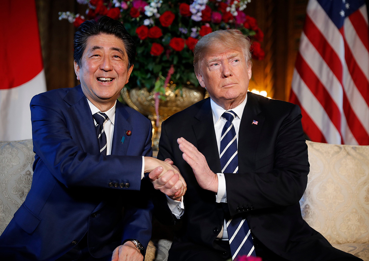 In this April 17, 2018 file photo, President Donald Trump and Japanese Prime Minister Shinzo Abe speak during a meeting at Trump's private Mar-a-Lago club, in Palm Beach, Fla.