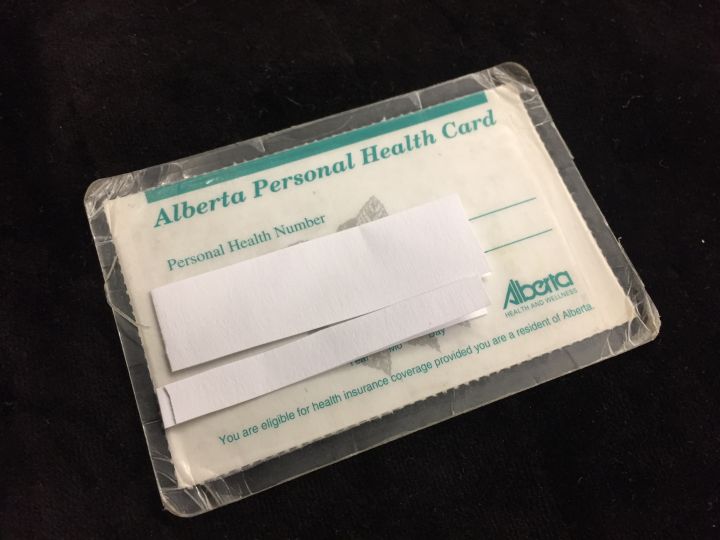 Alberta issues health cards on paper card stock.