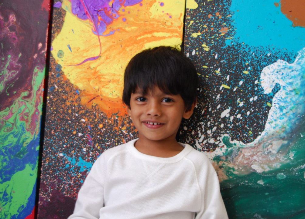 Advait Kolarkar, 4, is seen in this undated handout photo. When he's not playing with dinosaurs or reading a book, 4-year-old Advait Kolarkar uses paint, canvases and his imagination to create internationally-recognized abstract artwork. The preschooler is already selling his paintings for thousands of dollars and has had his art featured in three exhibits. 