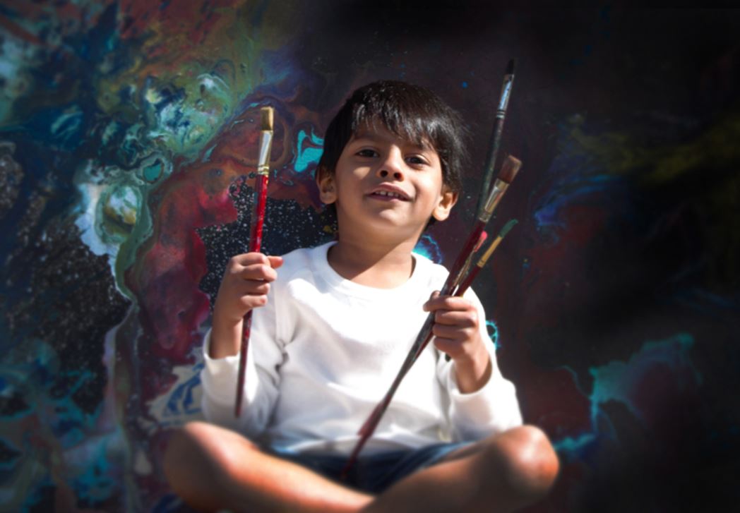Advait Kolarkar, 4, is seen in this undated handout photo. When he’s not playing with dinosaurs or reading a book, 4-year-old Advait Kolarkar uses paint, canvases and his imagination to create internationally-recognized abstract artwork. The preschooler is already selling his paintings for thousands of dollars and has had his art featured in three exhibits.