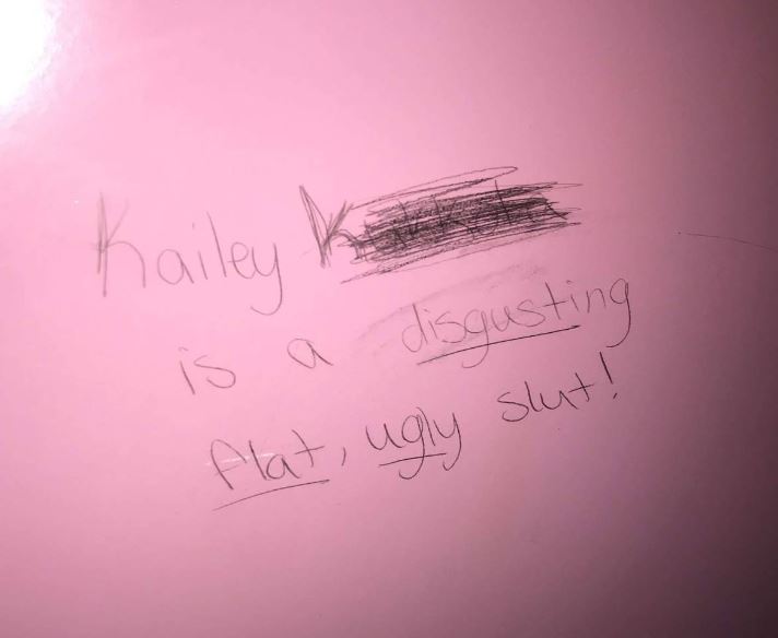 The message scrawled on the bathroom wall at school. Photo submitted.