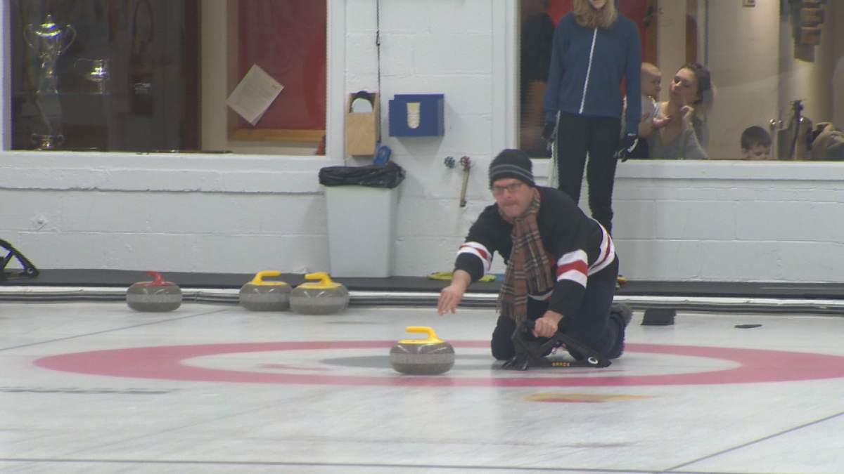 Global Montreal’s Billy Shields tosses a stone for a good cause at the Kurling for Kids charity fundraiser in Lacine.