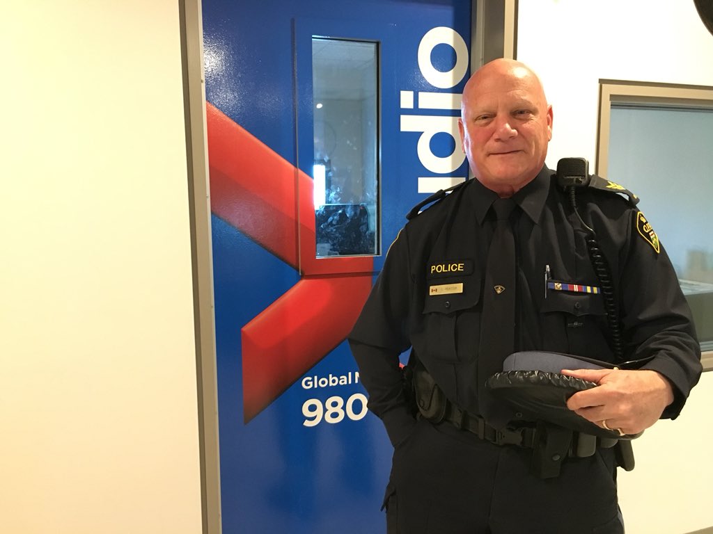 OPP. Srg. Dave Rektor stand outside the 980 CFPL studio doors for an interview with Craig Needles.