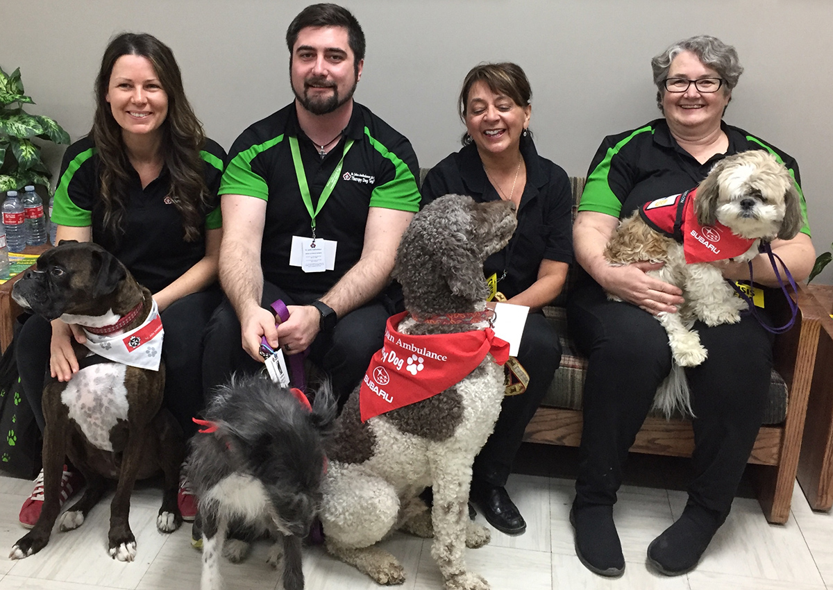 Dr. Colleen Dell and Subie; Justin Morrison and Jet; Wendy Stoeber and Womble; Stephanie Peachey and Dude.