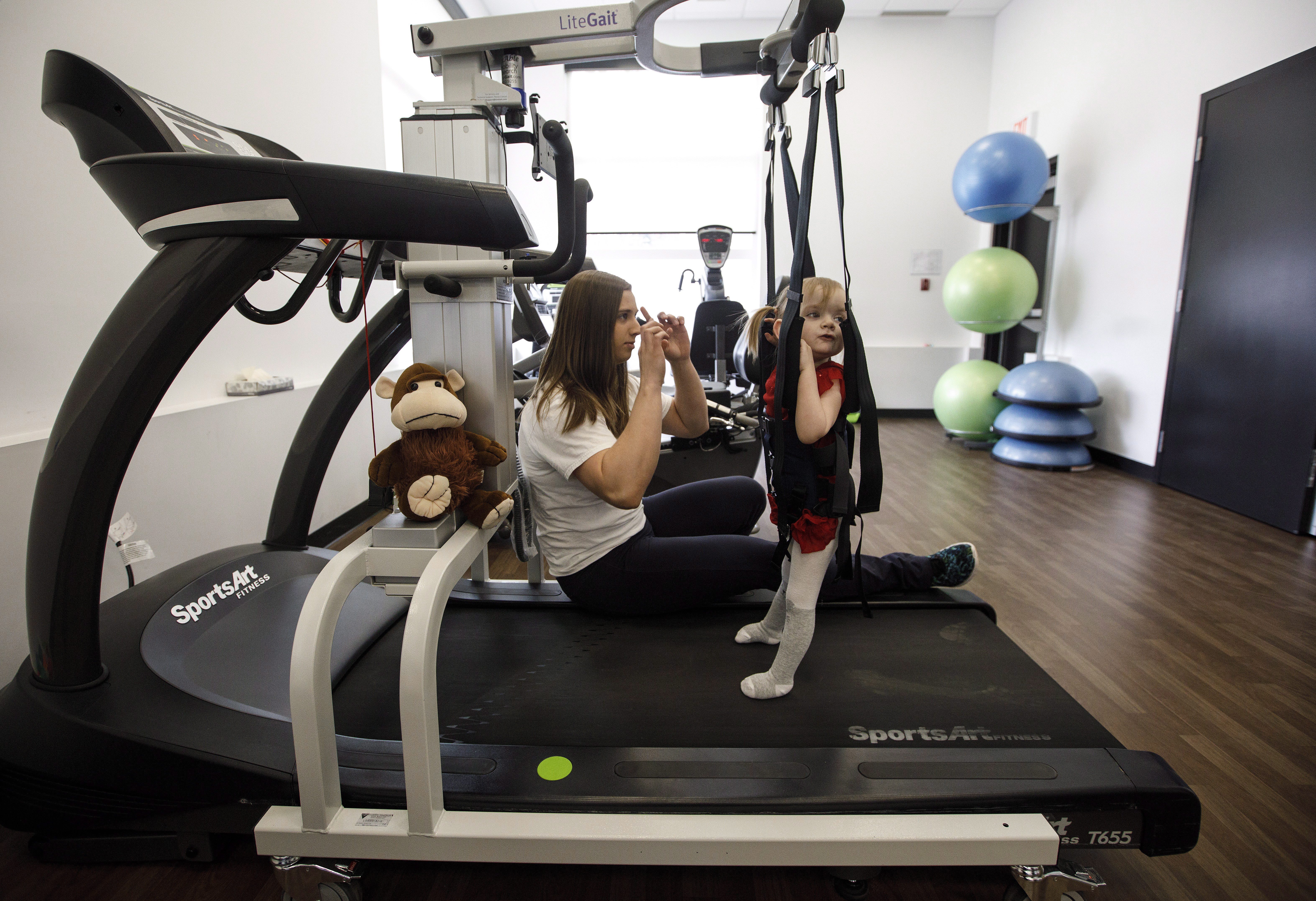 Paralyzed Edmonton toddler moves from homemade Bumbo wheelchair to treadmill Globalnews