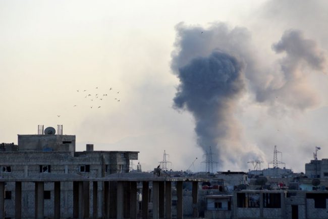  Smoke rises after Assad regime forces carry out airstrikes over the Daesh-controlled part of Yarmouk refugee camp where Palestinian refugees take shelter, on the outskirts of Syrias capital Damascus on April 24, 2018. 