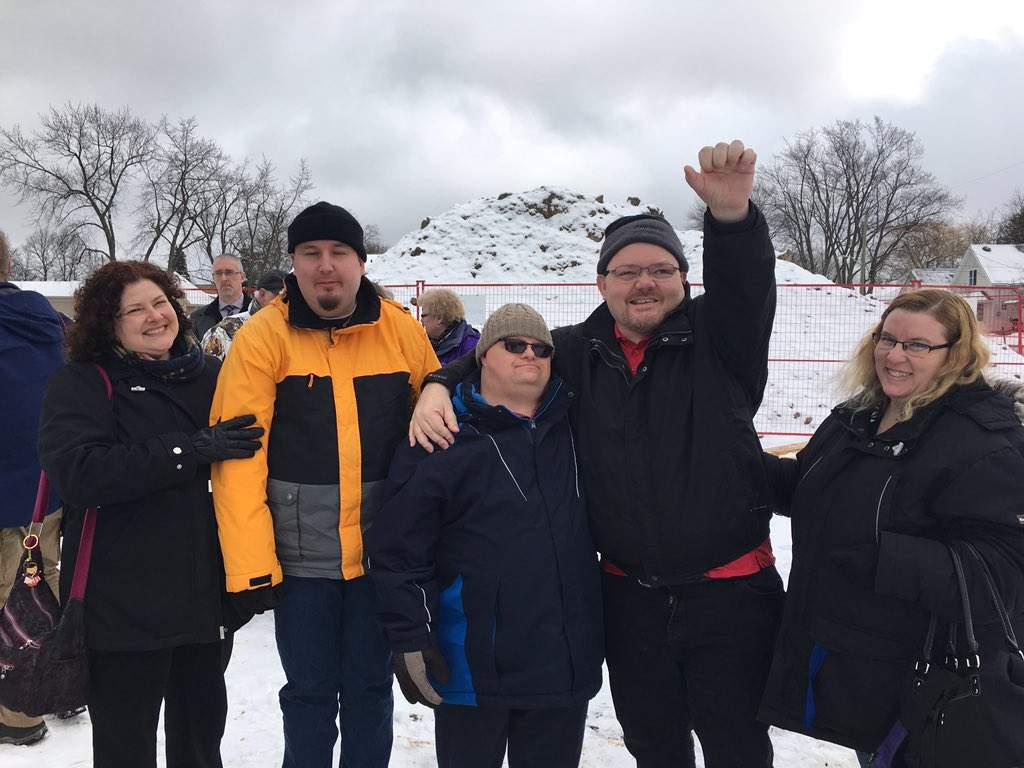Chris Petrie, Ross Wilson and Justin Thomas are smiling with their support staff Teresa (left) and Connie Loker (right).