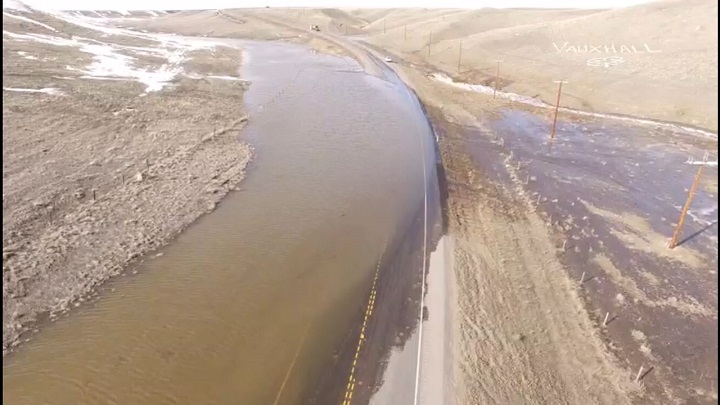 Water is pooling on Highway 36 near Taber, Alberta Saturday.
