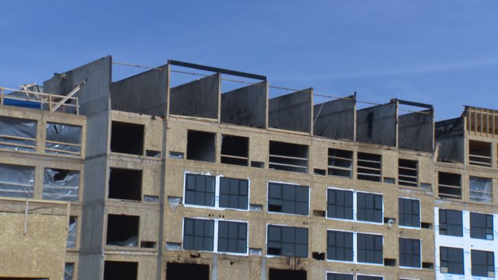 Crews say the concrete walls acted as a fire wall; it’s one of the first six-story wood structures in Saskatoon.