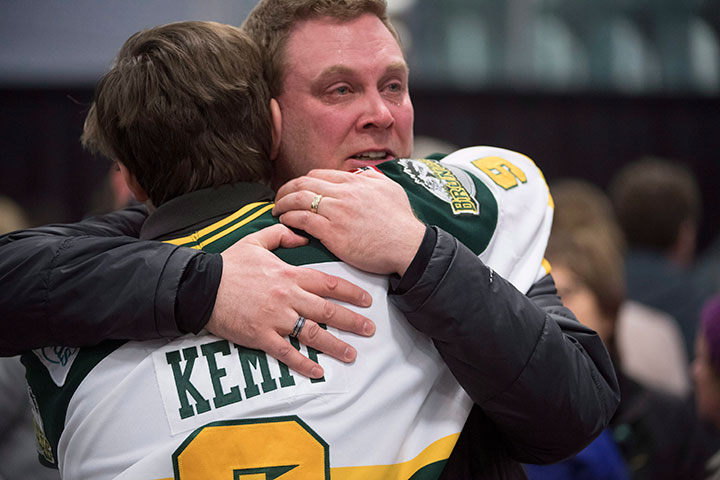Mourners comfort each other during a vigil at the Elgar Petersen Arena, home of the Humboldt Broncos, to honour the victims of a fatal bus accident in on Sunday, April 8, 2018.