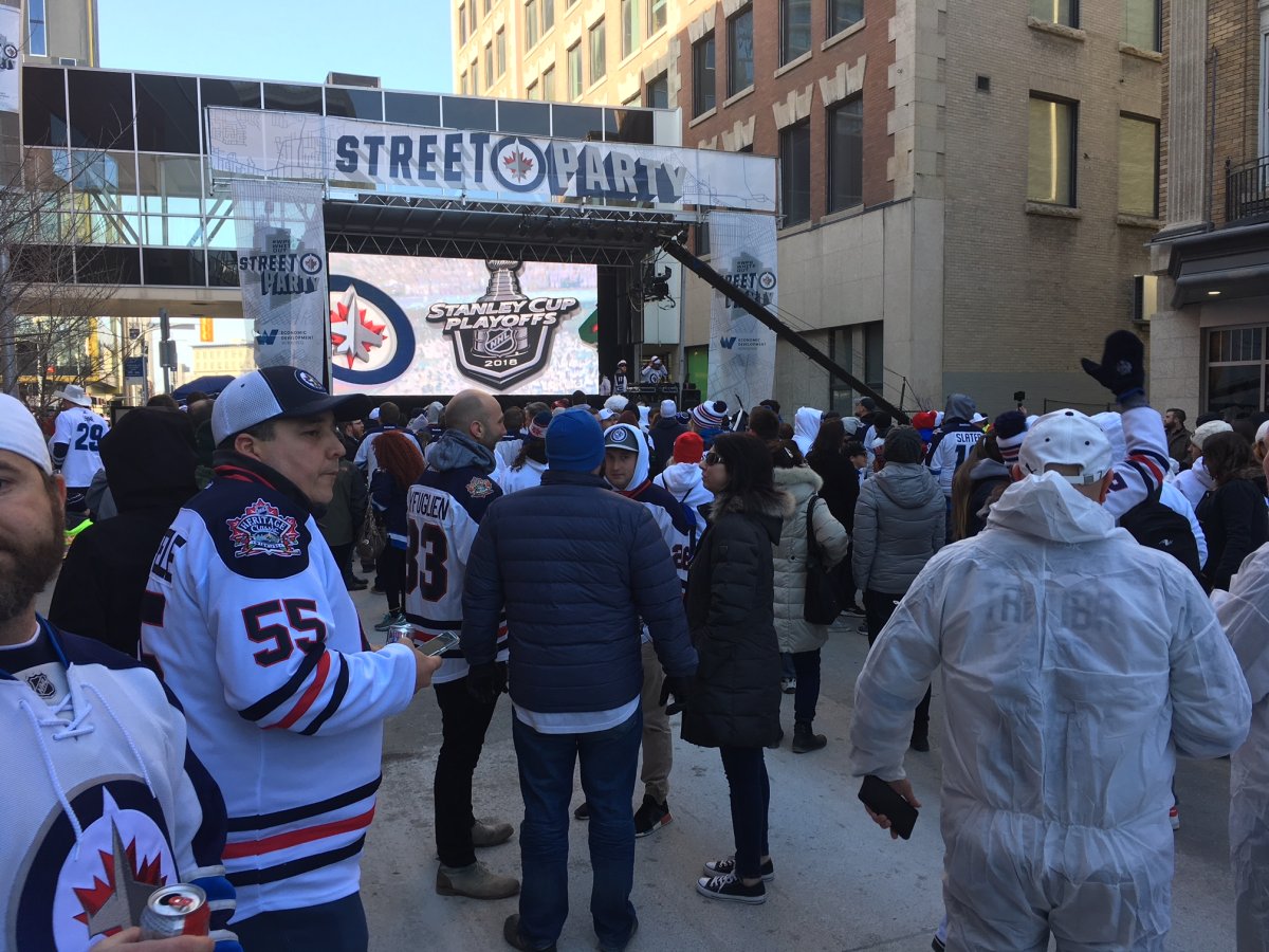 Jet fans get set to watch Game 2 at the Winnipeg Whiteout Street Party Friday.