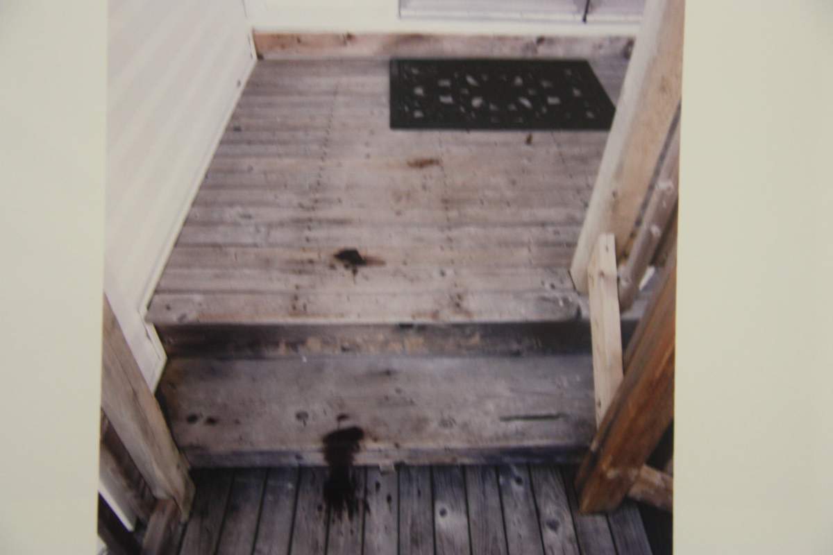 Blood stains on the porch of Kristin Johnston’s home are seen in this court exhibit photograph.