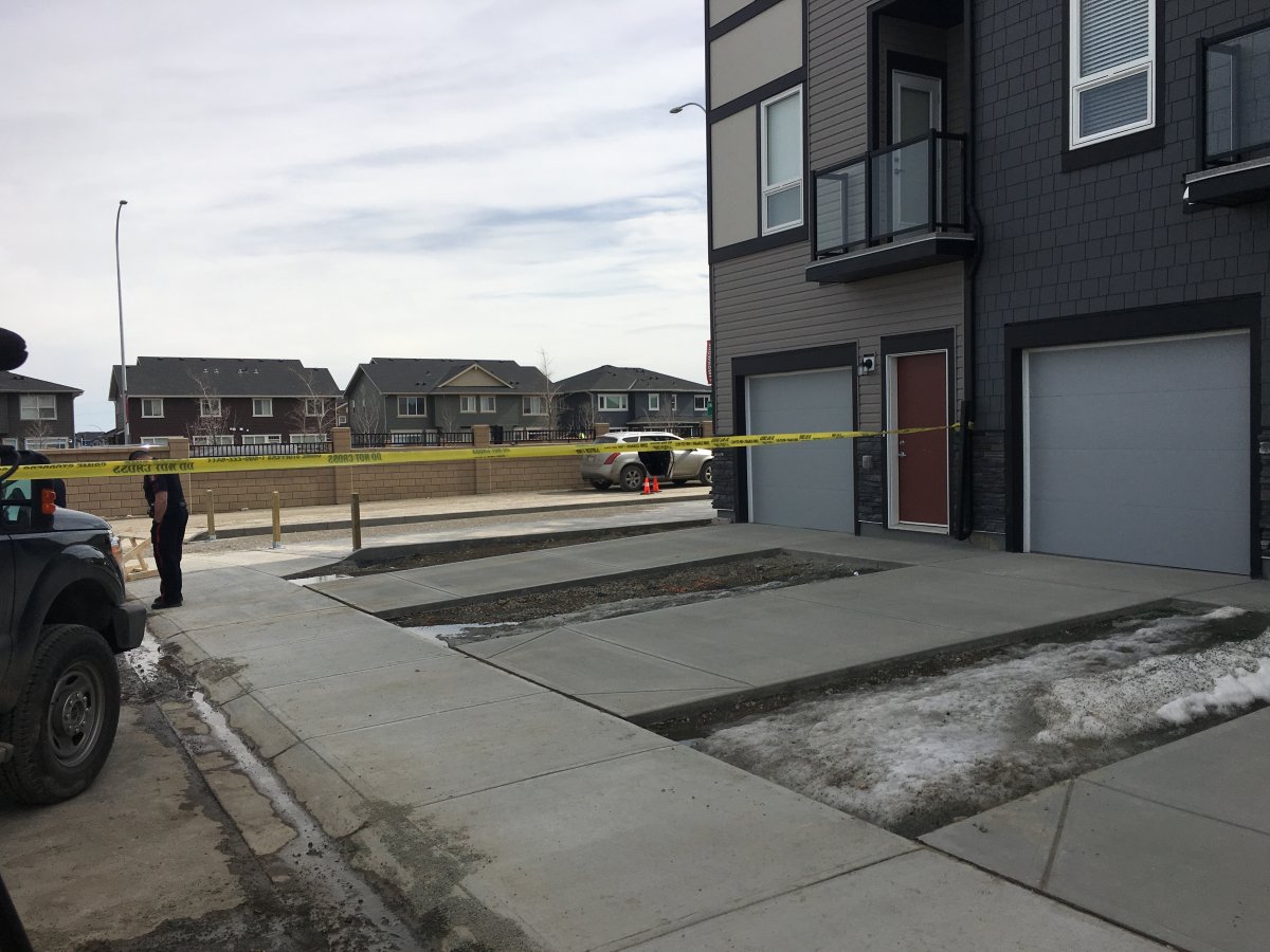 Calgary police on the scene of a shooting where two people were found dead on Friday, April 20, 2018.