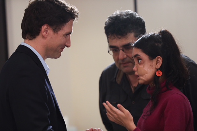 Prime Minister Justin Trudeau, translator Kian Ghaffari and Shakila Zareen.