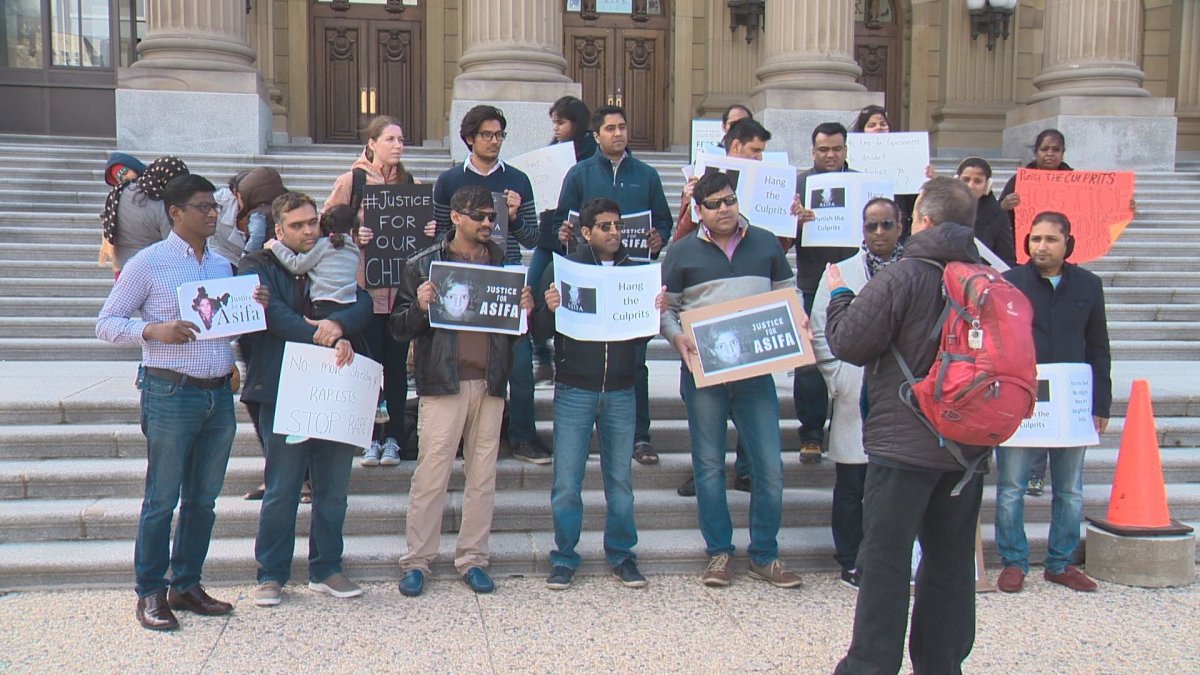 Edmonton residents protest the rape and murder of an 8-year-old girl in Indian, Sunday, April 22, 2018. 