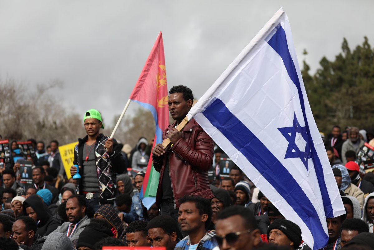 African asylum seekers, mostly from Eritrea, take part in a protest against Israel's deportation policy in front of the Knesset (Israeli Parliament) in Jerusalem on January 26, 2017. / AFP / GALI TIBBON        (Photo credit should read GALI TIBBON/AFP/Getty Images).