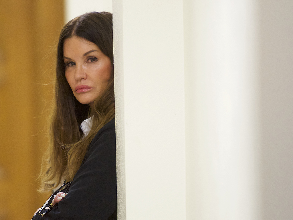 Bill Cosby accuser Janice Dickinson waits outside a courtroom in the Montgomery County Courthouse before testifying on the fourth day of the sexual assault retrial on April 12, 2018 in Norristown, Pennsylvania. 