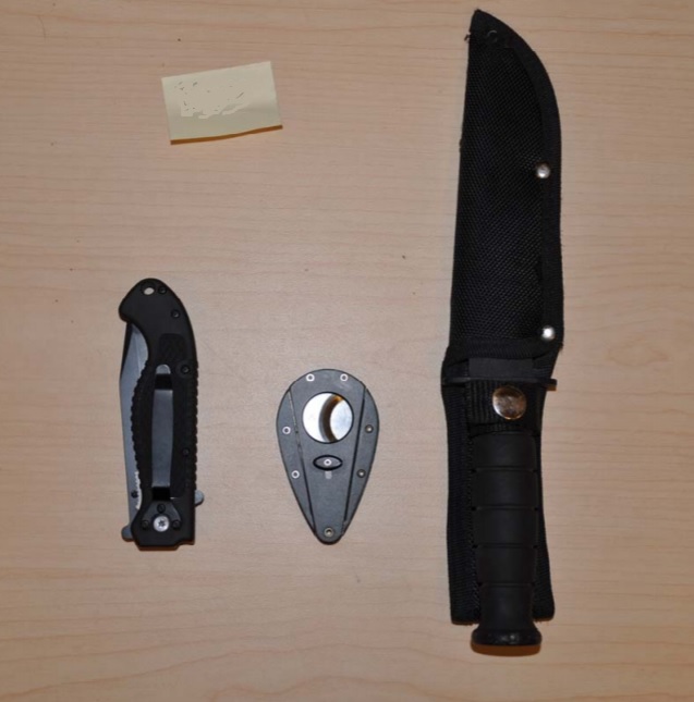 A photo from Kingston police showing the two knives they say they confiscated from a biker on April 24.
