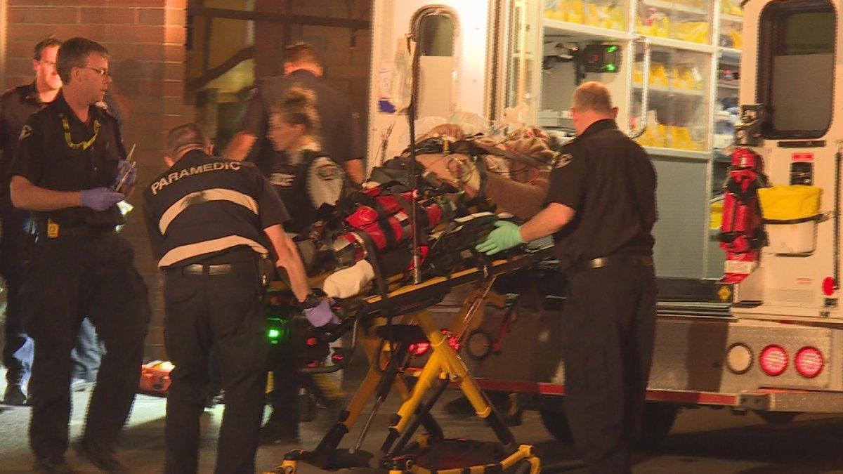 Cardiac arrest patient found in downtown alley being placed in ambulance April 24, 2018 in Kelowna. 