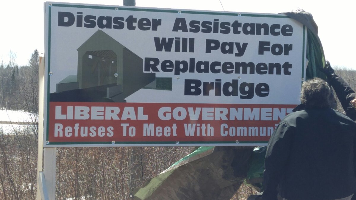 Residents in Cherryvale, NB have put up a billboard to put pressure on the province to meet with them to discuss the need for a new bridge in their community.