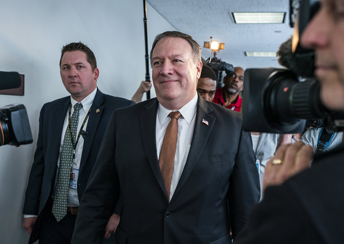 CIA Director Mike Pompeo leaves a meeting with Democratic Senator from Virginia Mark Warner (out of frame) in the Hart Senate Office Building in Washington.