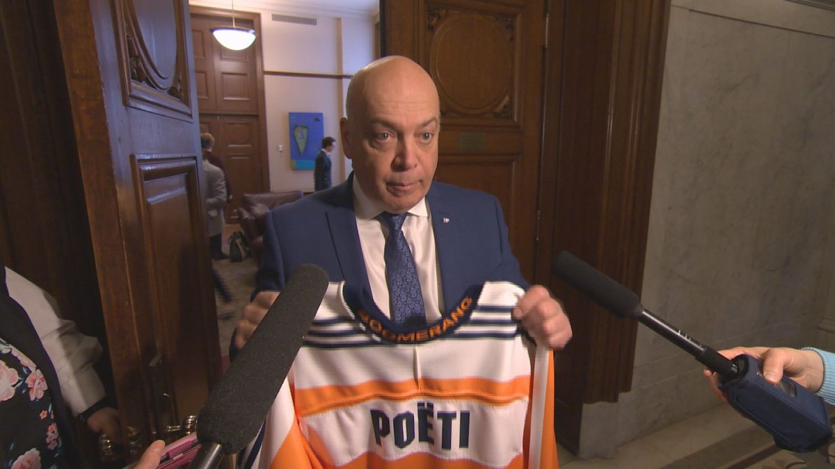 Quebec MNA Robert Poëti shows off his jersey at the National Assembly to show solidarity with those who died in the Humboldt bus crash, Weds. April 18, 2018.