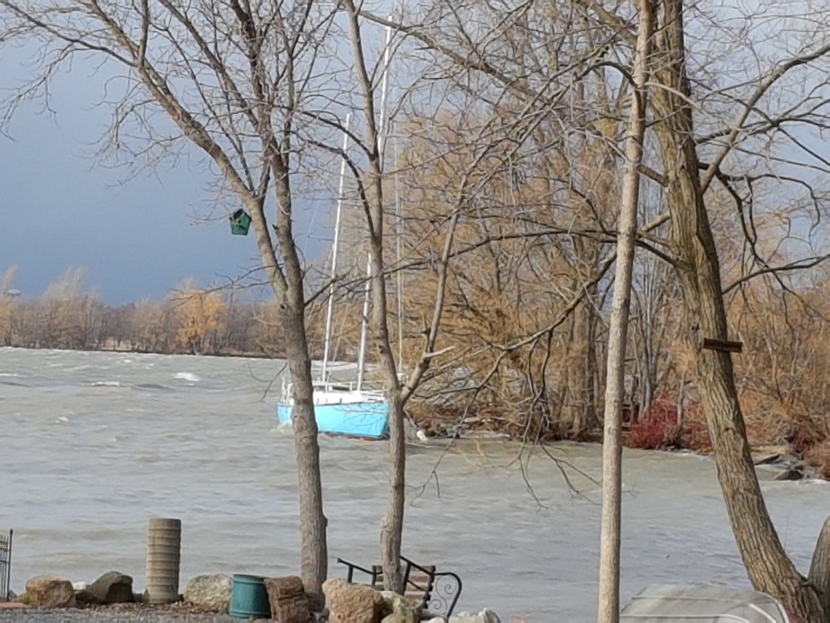 A sailboat being tested for the Northwest Passage has been detached from its moorings off of Wolfe Island due to high winds.