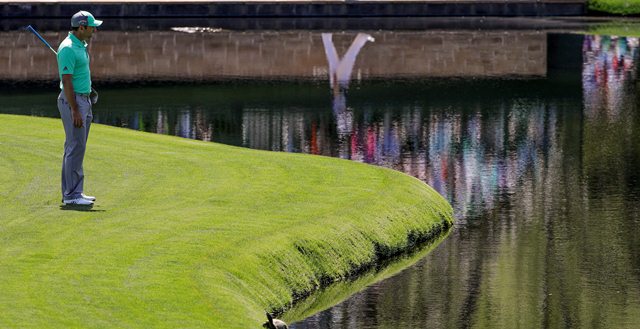 Sergio Garcia, of Spain, looks over the water on the 15th hole during the first round at the Masters golf tournament Thursday, April 5, 2018, in Augusta, Ga. Garcia shot an 8-over 13 on the hole.
